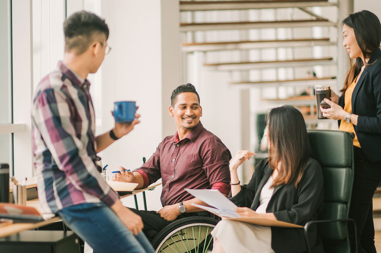 Group of employees discussing the diversity of their experiences.