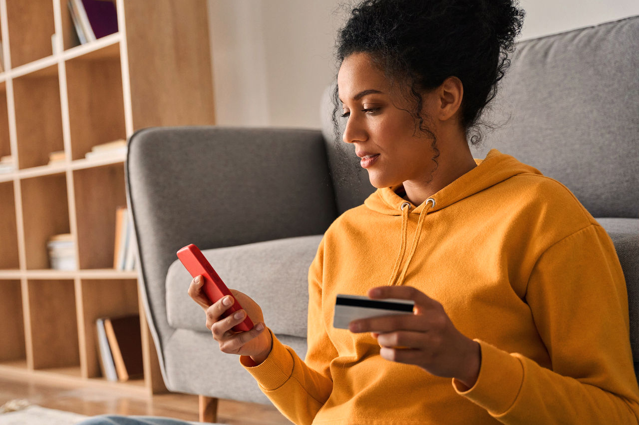 Woman activating a prepaid card on her smartphone. 