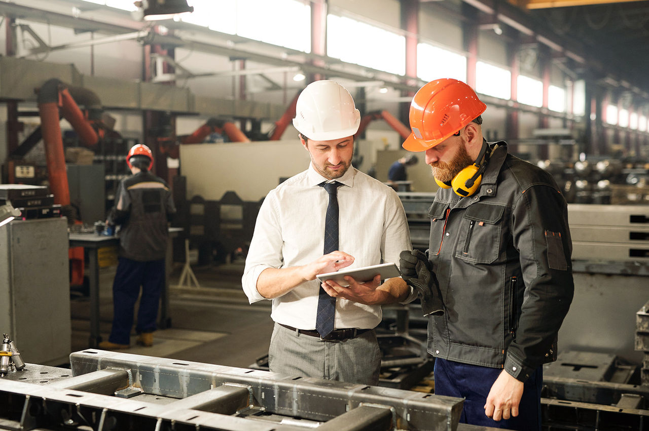 Team reviewing operations on a tablet